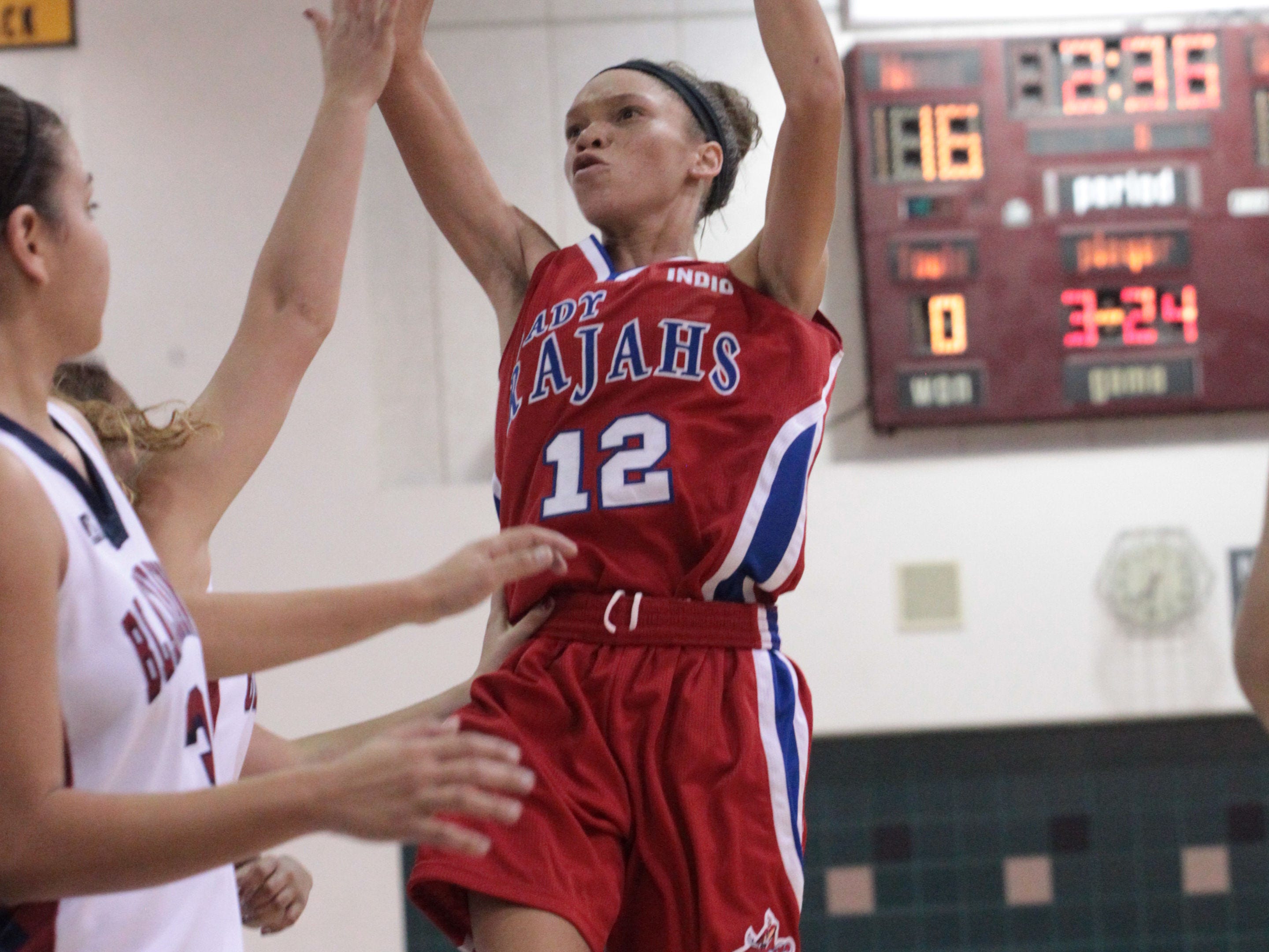 Indio High School's Jazmyne Santiel shoots a basket during their contest against La Quinta High School at La Quinta on Tuesday night.