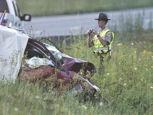 A member of the Vermont State Police processes the