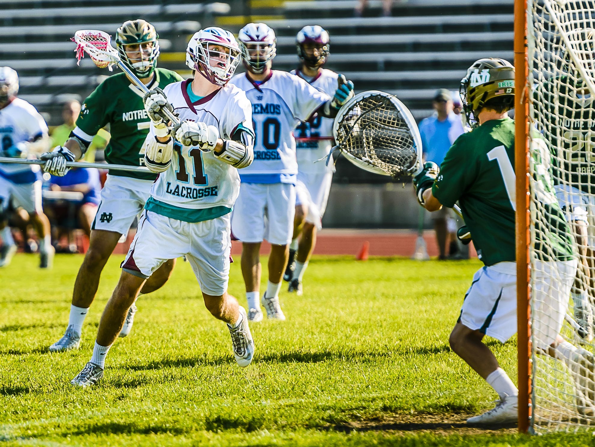 Bennett Sherman,11,of Okemos lines up a shot on the Notre Dame Prep goal during its Division 2 Regional Final June 3, 2016 in DeWitt.