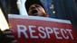 An immigrant from Guyana takes part in a demonstration at McDonald's in Midtown, New York City.