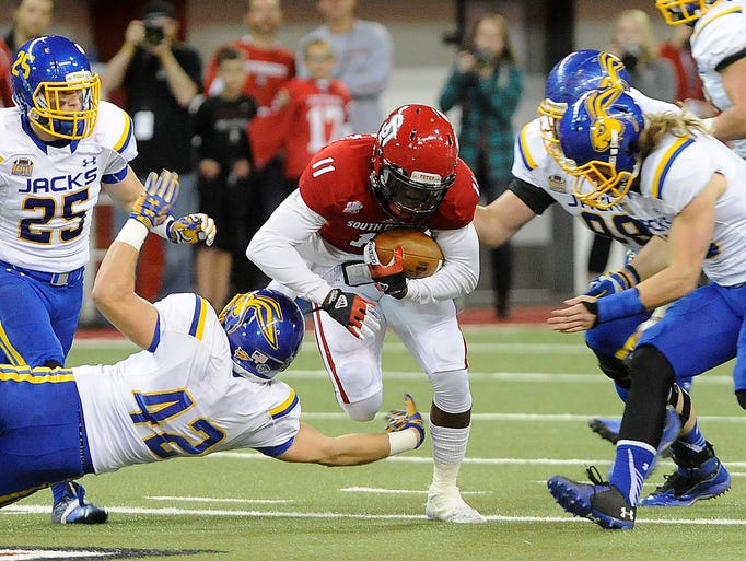USD's #11 Eric Shufford Jr. rushes down the field against