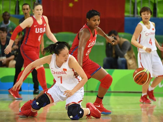 Angel Mccoughtry of the United States, left, fights