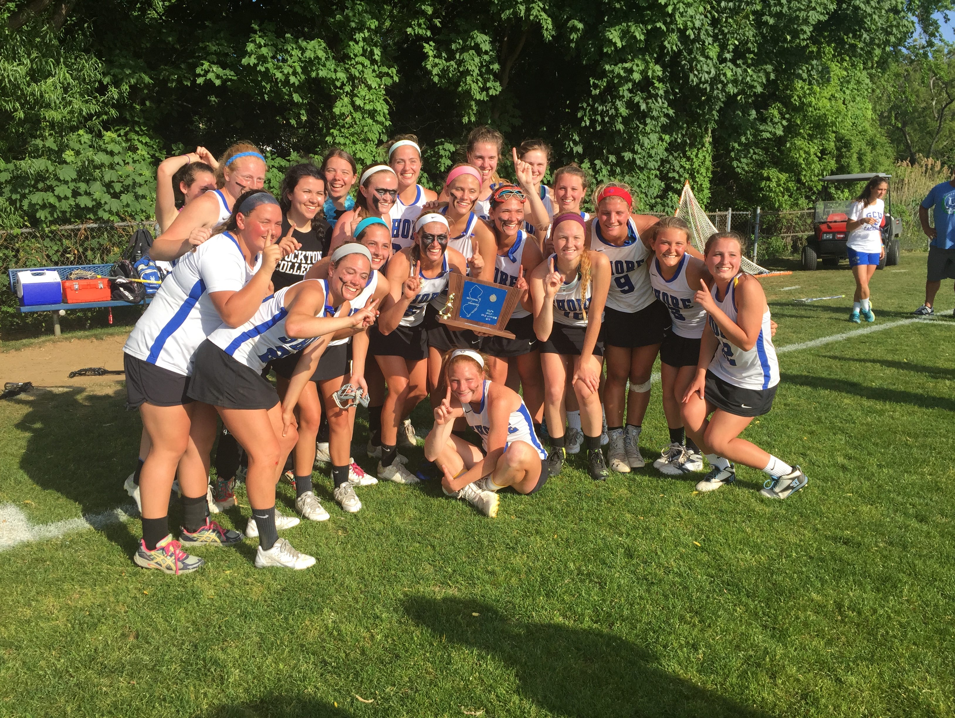 The Shore Regional girls lacrosse team celebrates winning the NJSIAA South Group I title on Wednesday afternoon.