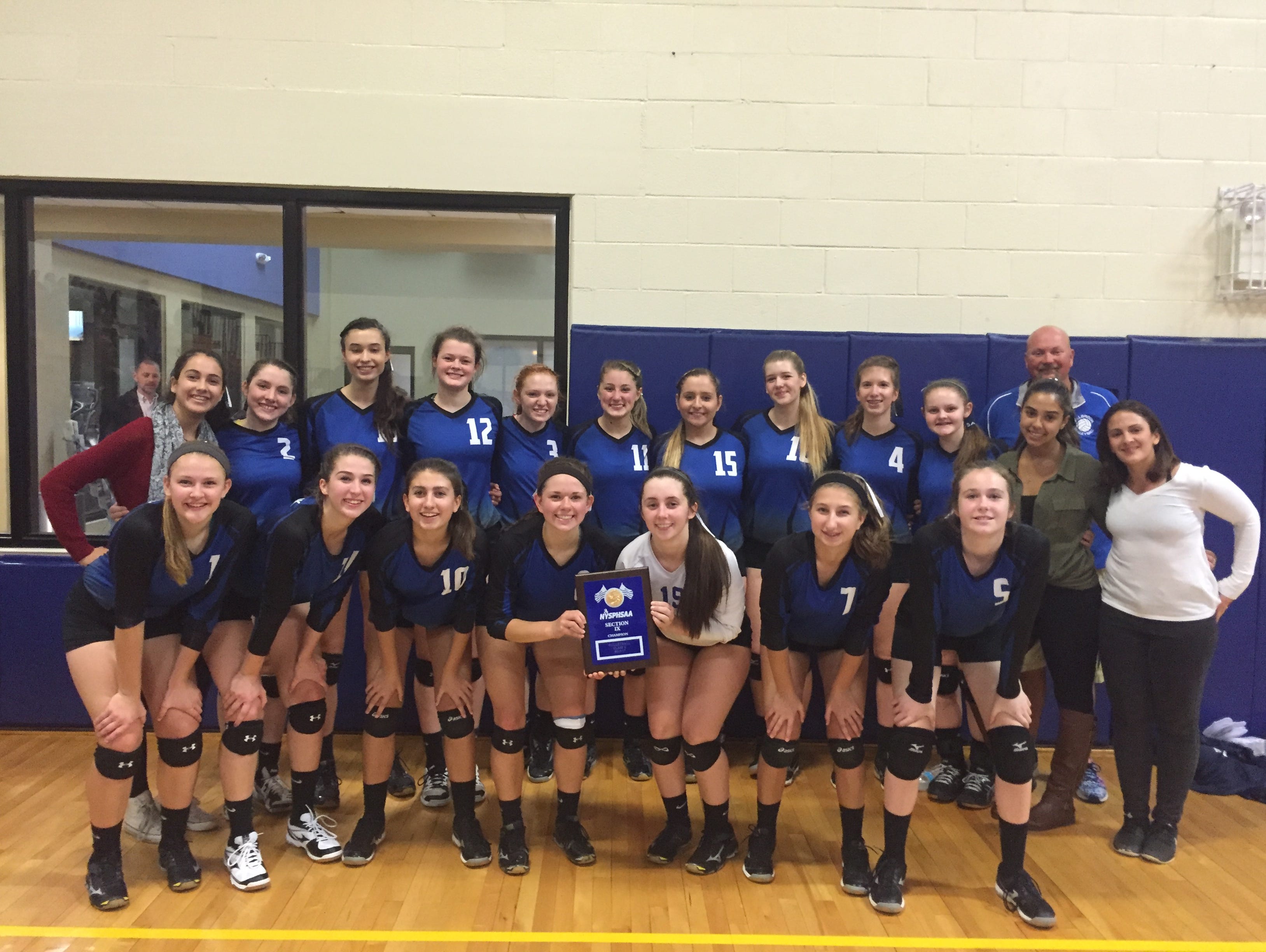 Millbrook High School's volleyball team poses after winning the Section 9 Class C title on Sunday.