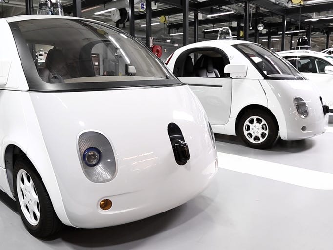 Google's self-drivign cars lined up at its headquarters