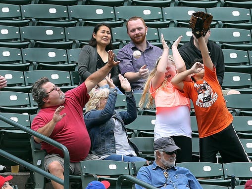 Fans at Frontier Field protect themselves as they try