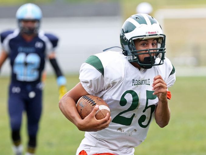 Pleasantville's Logan Schneeweiss (25) runs for a first half touchdown after catching a pass against Westlake during football action at Westlake High School in Thornwood Sept. 12, 2015. Pleasantville won the game 20-6.