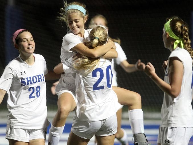 Shore Regional's Frankie McDonough leaps into the arms of teammate Sophie Hauritz after scoring a second half goal against Metuchen in the Central Group I girls soccer sectional final, Thursday, November 12, 2015, in West Long Branch. Jason Towlen/Staff Photographer