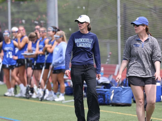 Bronxville head coach Sharon Robinson (center) roams the sidelines next to assistant coach Jackie Pierce (right) during a game against Somers at Somers High School on May 14th, 2016.