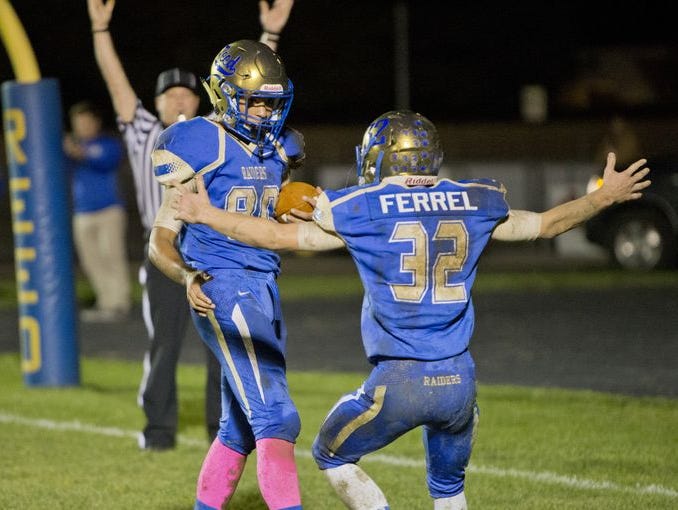 Michael Spivack and Robert Ferrel celebrate a touchdown last season.