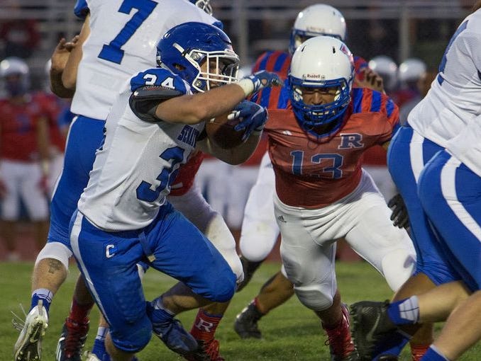 Carson's Abel Carter runs against Reno on Sept. 2 at Reno