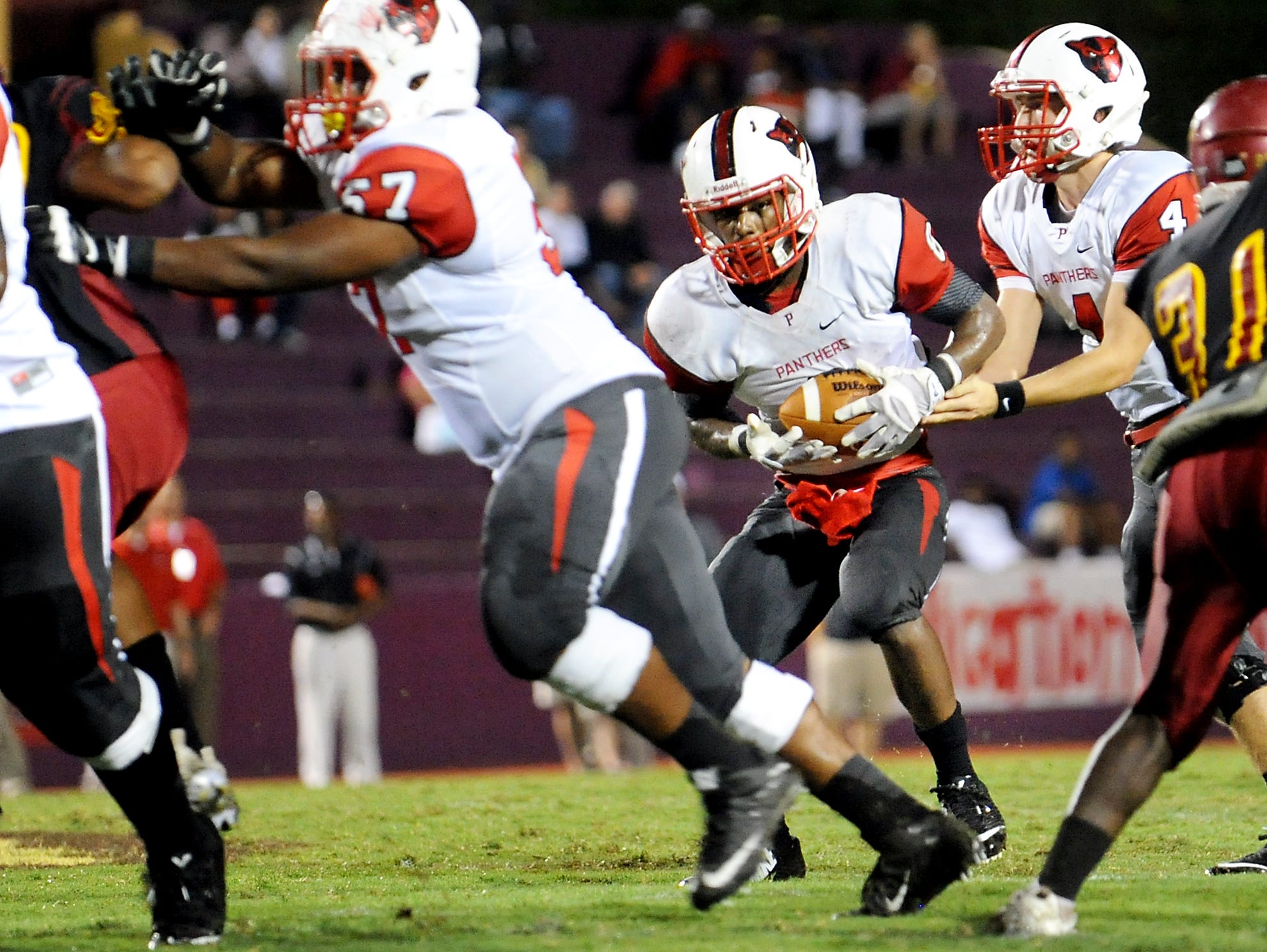 Petal player Samuel Hopper (4) hands off to Stephon Huderson (8) during a game against Laurel at Laurel High School earlier this season.