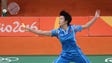 Yuanting Tang (CHN) hits the shuttlecock as she and