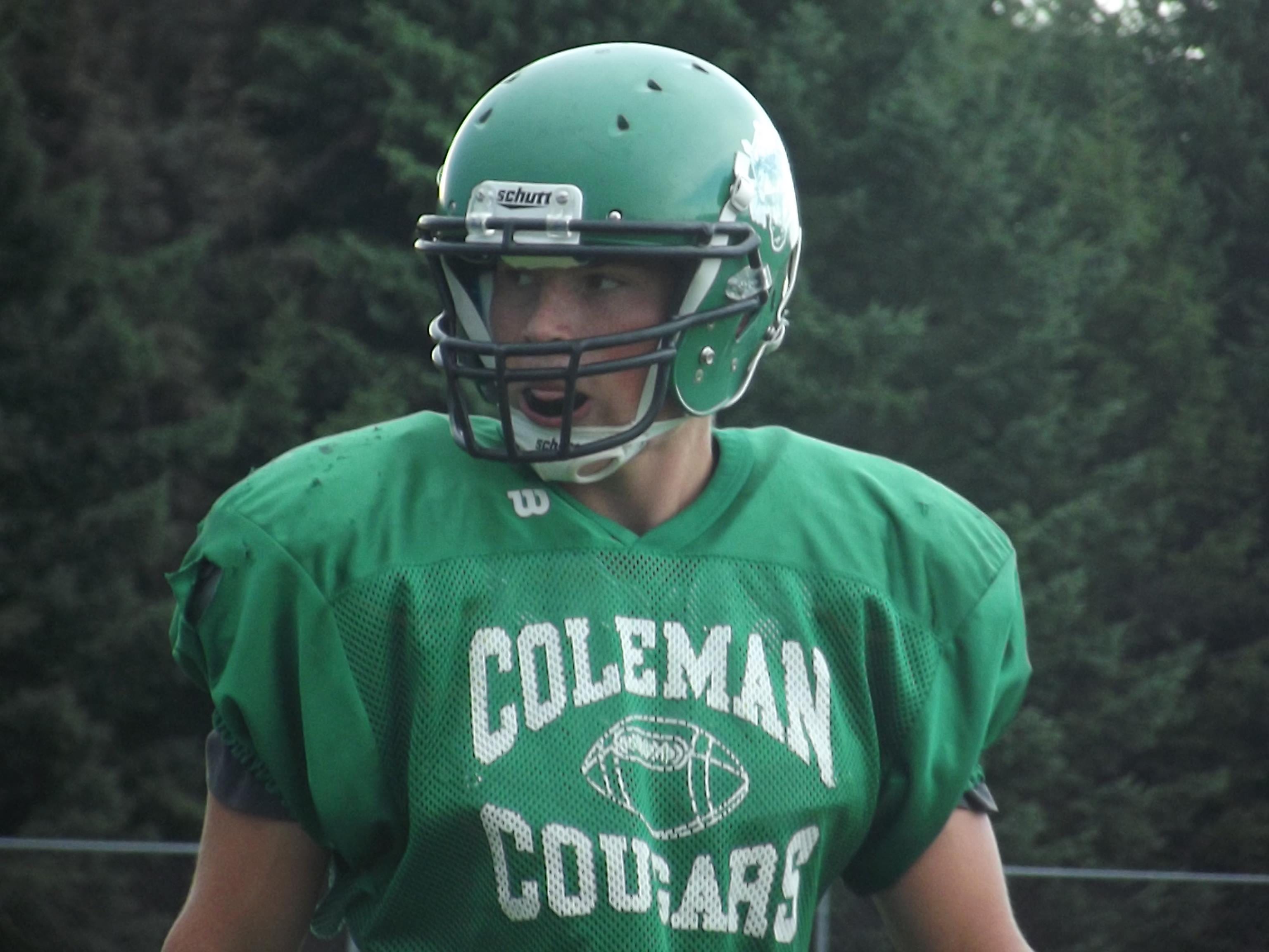 Coleman senior Blake Margis gets set to line up on defense during a scrimmage Friday at Algoma. The Cougars are trying to repeat as M&O Conference champions.