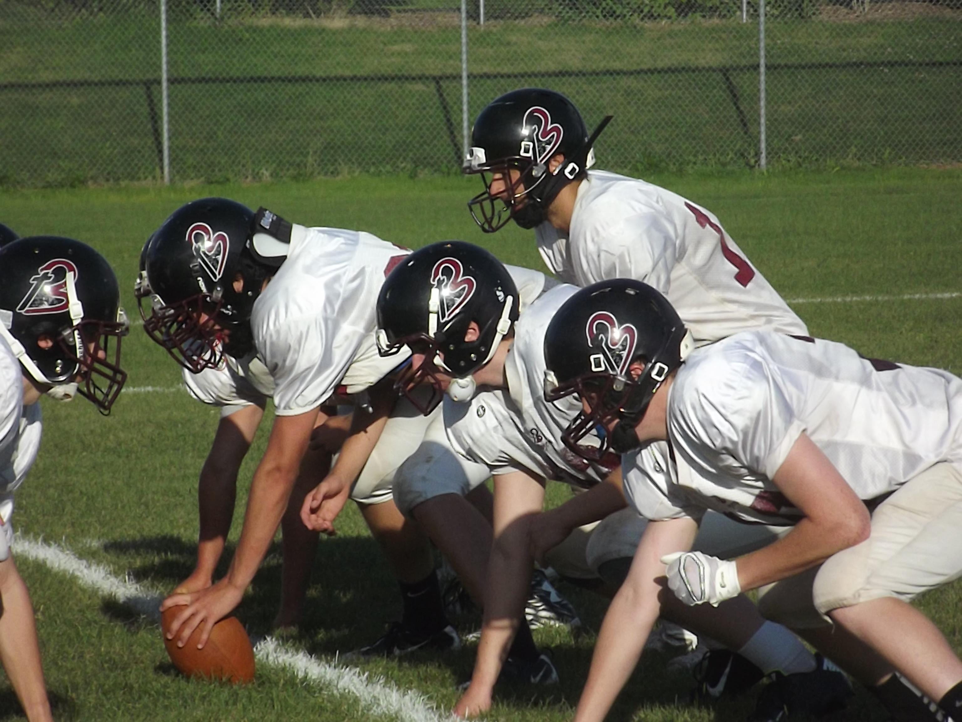 N.E.W. Lutheran James Lana gets ready to take a snap at practice Tuesday. Lana is replacing Noah Gosse at quarterback.