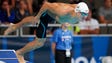 Nathan Adrian dives off the starting block during the