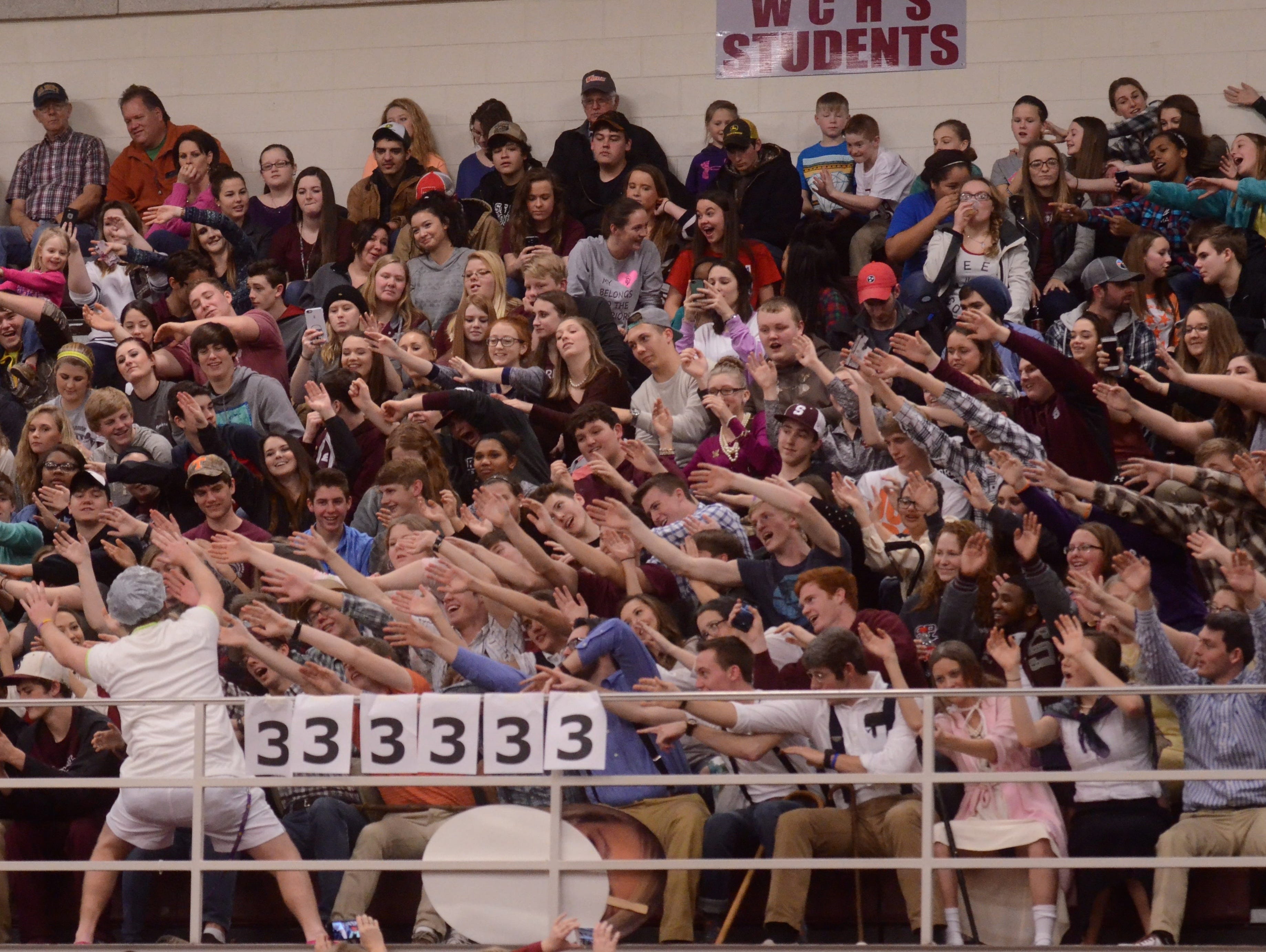 The White County student section cheers on the Spartans during Monday's regular-season finale.