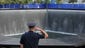 2011: A New York City police officer salutes at the