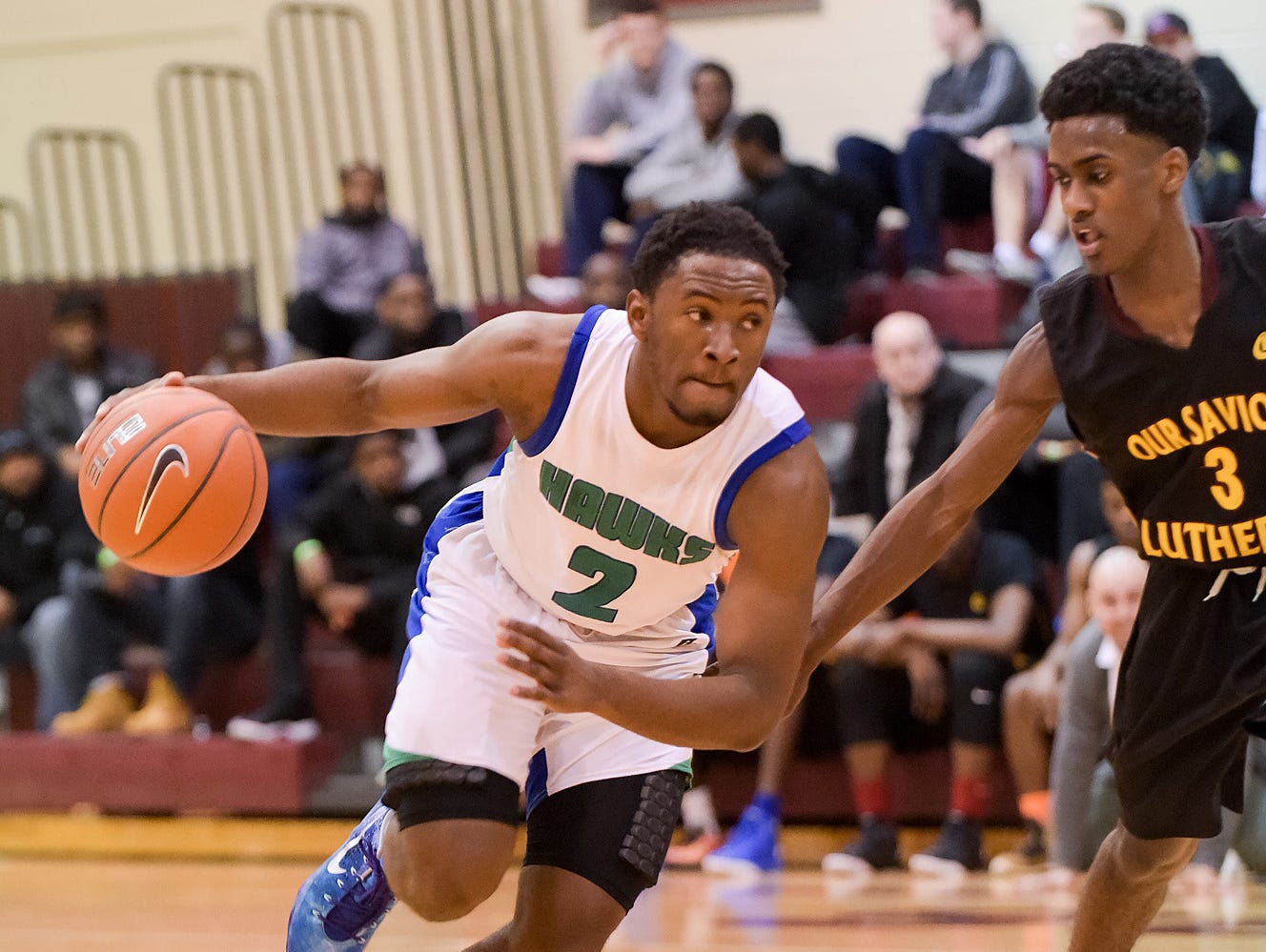 Kyson Rawls (2) of St. Georges drives against Matt Williams (3) of Our Saviour Lutheran of Bronx, N.Y., during the Concord Classic on Monday.