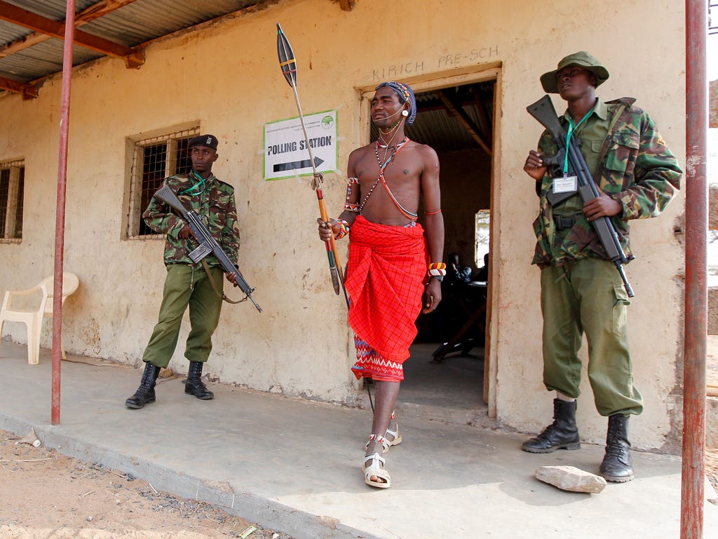 A Kenyan Samburu warrior leaves a polling station in Nkirish after voting in the general elections on Aug. 8, 2017.\u000d\u000aKenyans began voting in general elections headlined by a too-close-to-call battle between incumbent Uhuru Kenyatta and his 