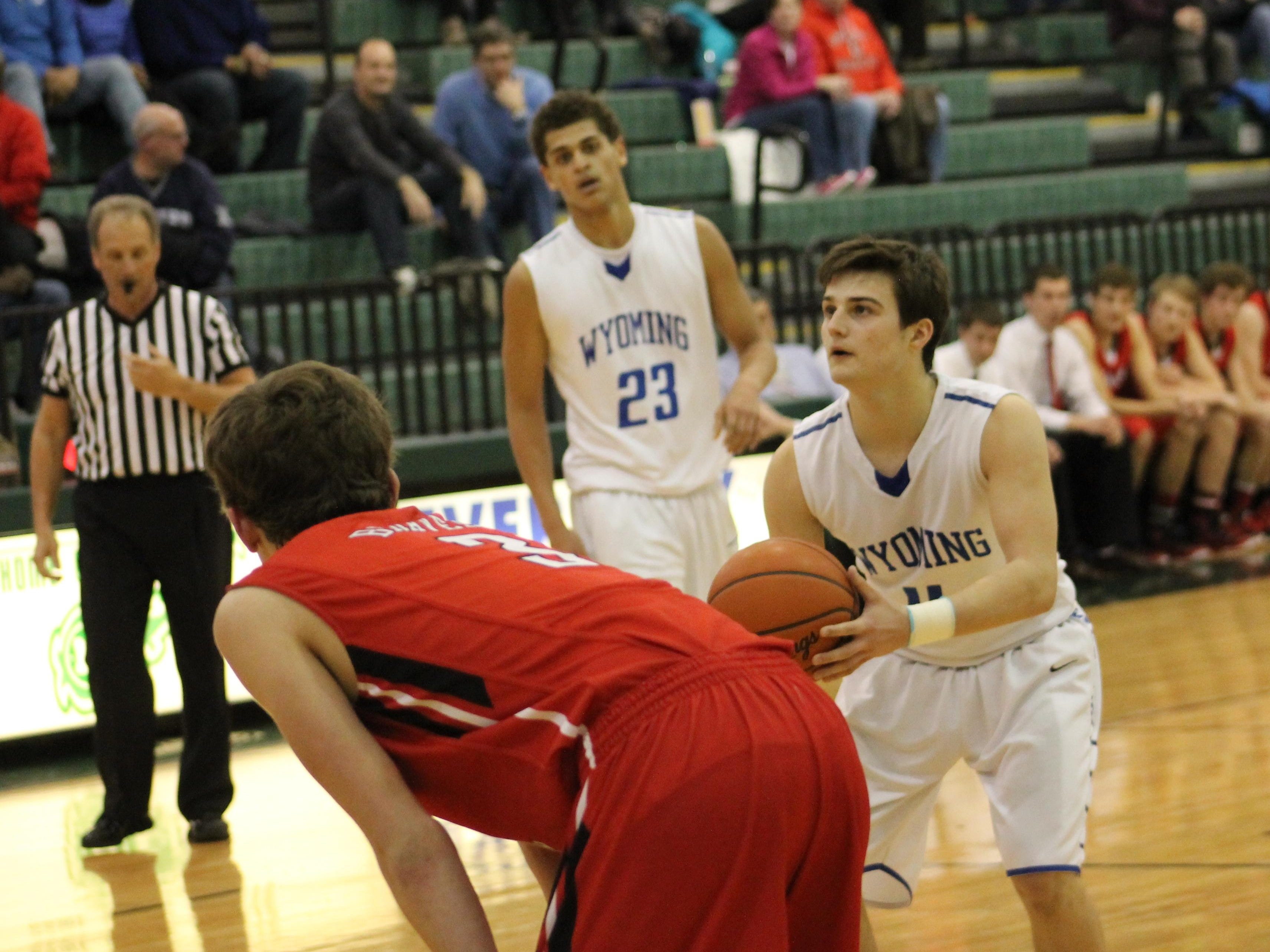 Wyoming’s Jake Edmonds eyes the basket from the charity stripe last March as Garyn Prater (23) looks on.