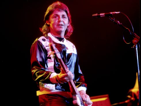 Paul McCartney performs with Wings in 1976.