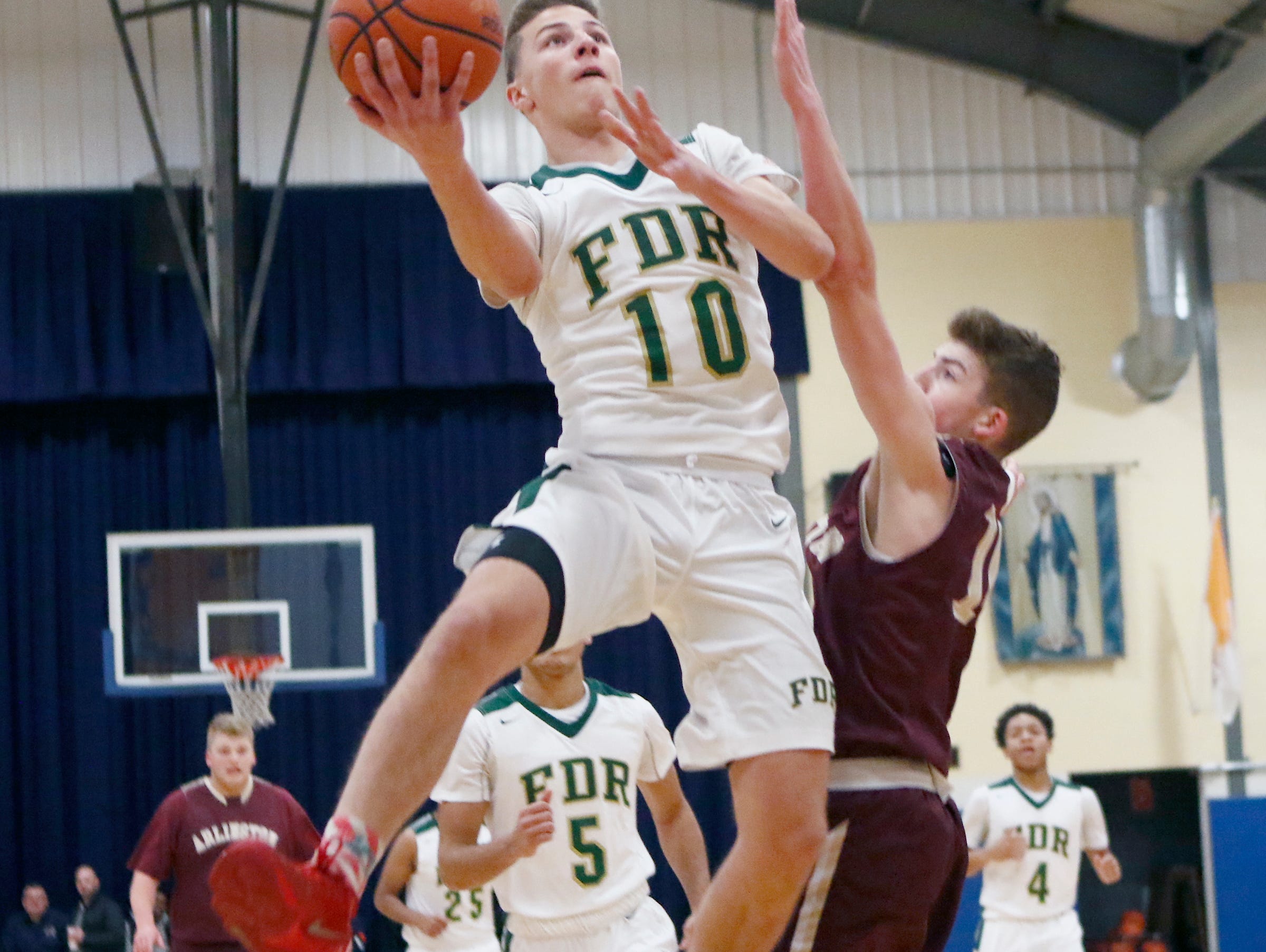 FDR's Ethan Hart (10) drives to the basket against Arlington in the consolation game of the Duane Davis memorial basketball tournament at Our Lady of Lourdes High School in Poughkeepsie on Saturday, December 31, 2016.