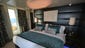 Bedrooms in the two Deluxe Owner's Suites feature king-size beds that face floor-to-ceiling windows and an extra-spacious wraparound private balcony. Each of the Deluxe Owner's Suites can be joined with an Owner's Suite to create a grand suite that sleeps up to eight people.