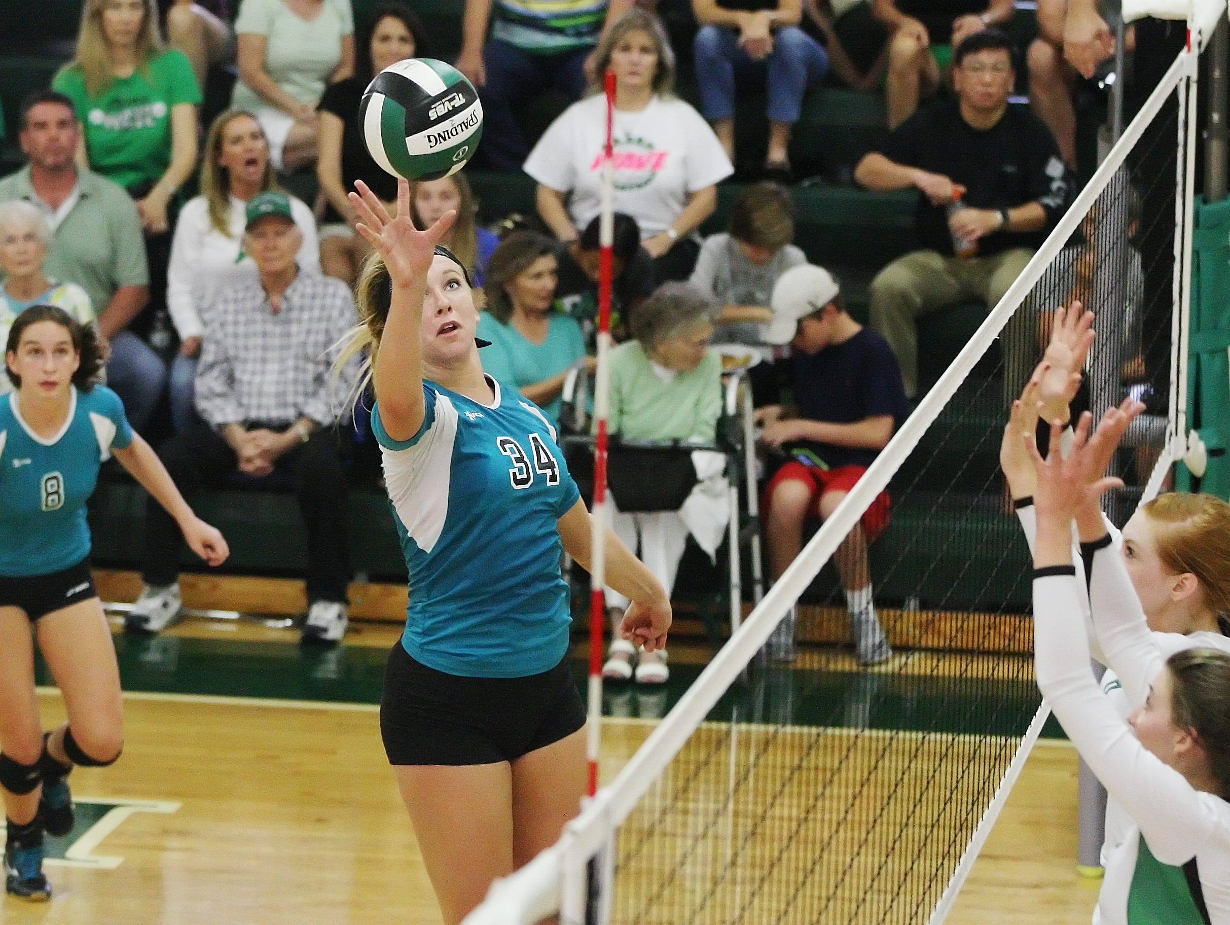 Jensen Beach High School's Madi Bell scores against Fort Myers during the Class 6A volleyball semifinals Saturday at Fort Myers High School.