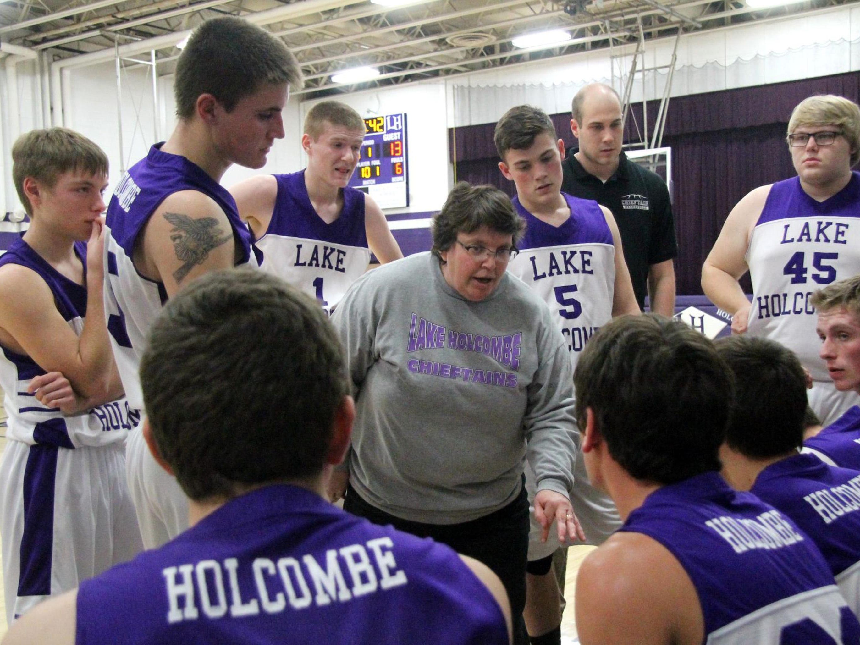 Coach Joy Webster, a New London native, talks to her Lake Holcombe varsity boys’ basketball team during a timeout against Cornell on Dec. 6 in Holcombe.