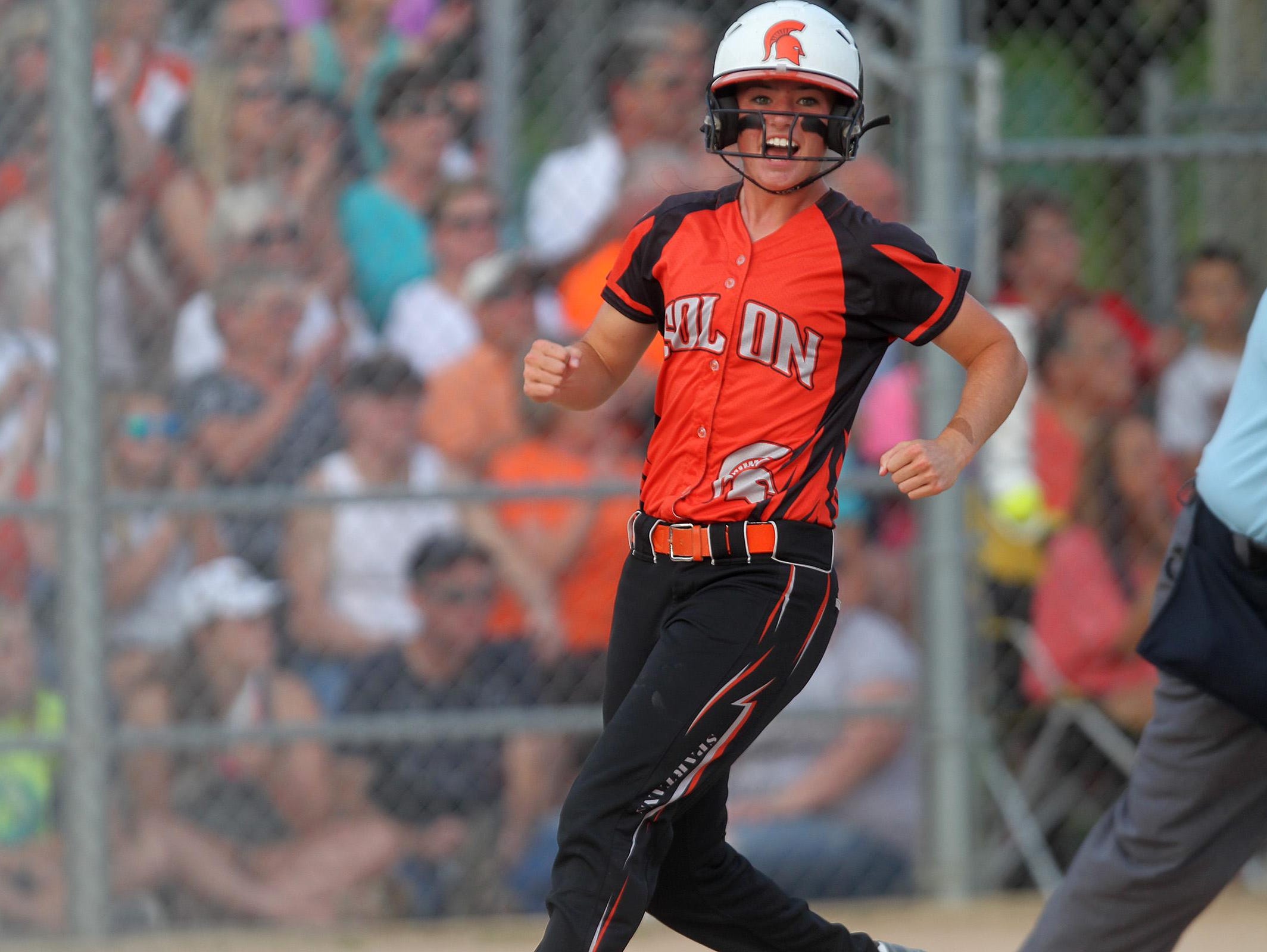 Solon's Sydney Lawson celebrates as she runs to home plate during the Spartans' regional game against Mid-Prairie at Solon on Friday, July 10, 2015.