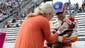 Kevin Harvick holds his son, Keelan, as his wife, DeLana, tends to him during pre-race ceremonies for the NASCAR Camping World Truck Series Kroger 200 at Martinsville Speedway on Oct. 27, 2012.
