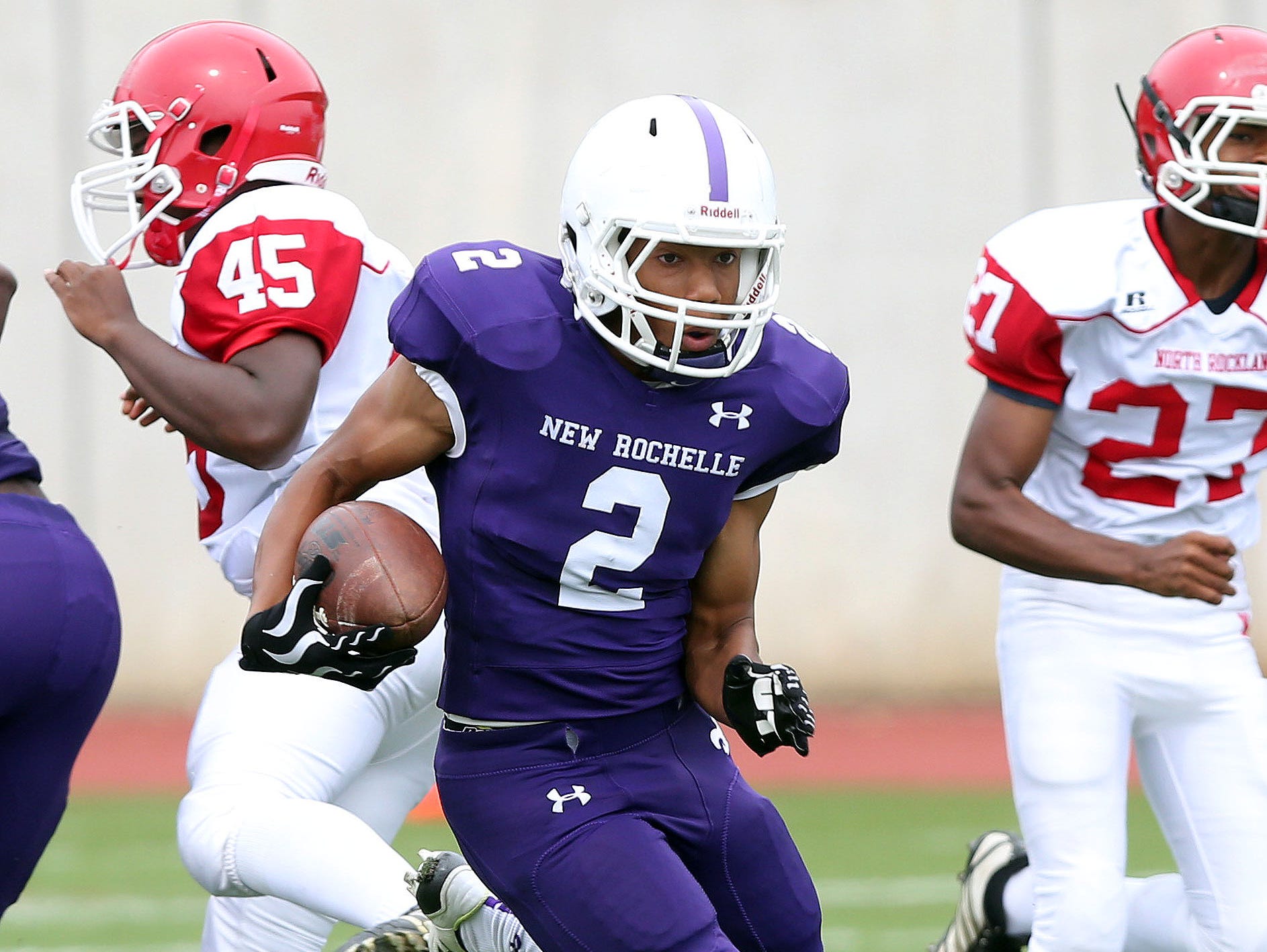 New Rochelle's Romeo Holden (2) puts on a few moves as he runs the opening kickoff back for a touchdown against North Rockland during football action at New Rochelle High School Sept. 3, 2016. New Rochelle won the game 34-13.