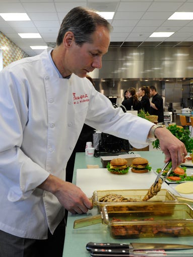 Brian Kolodziej, Senior Manager of Culinary for Chick-fil-A, makes the company's new grilled chicken club sandwich at The Bench Top area of the Chick-fil-A headquarters. The Bench Top is where development and prototyping work is done by product developers and chefs.
