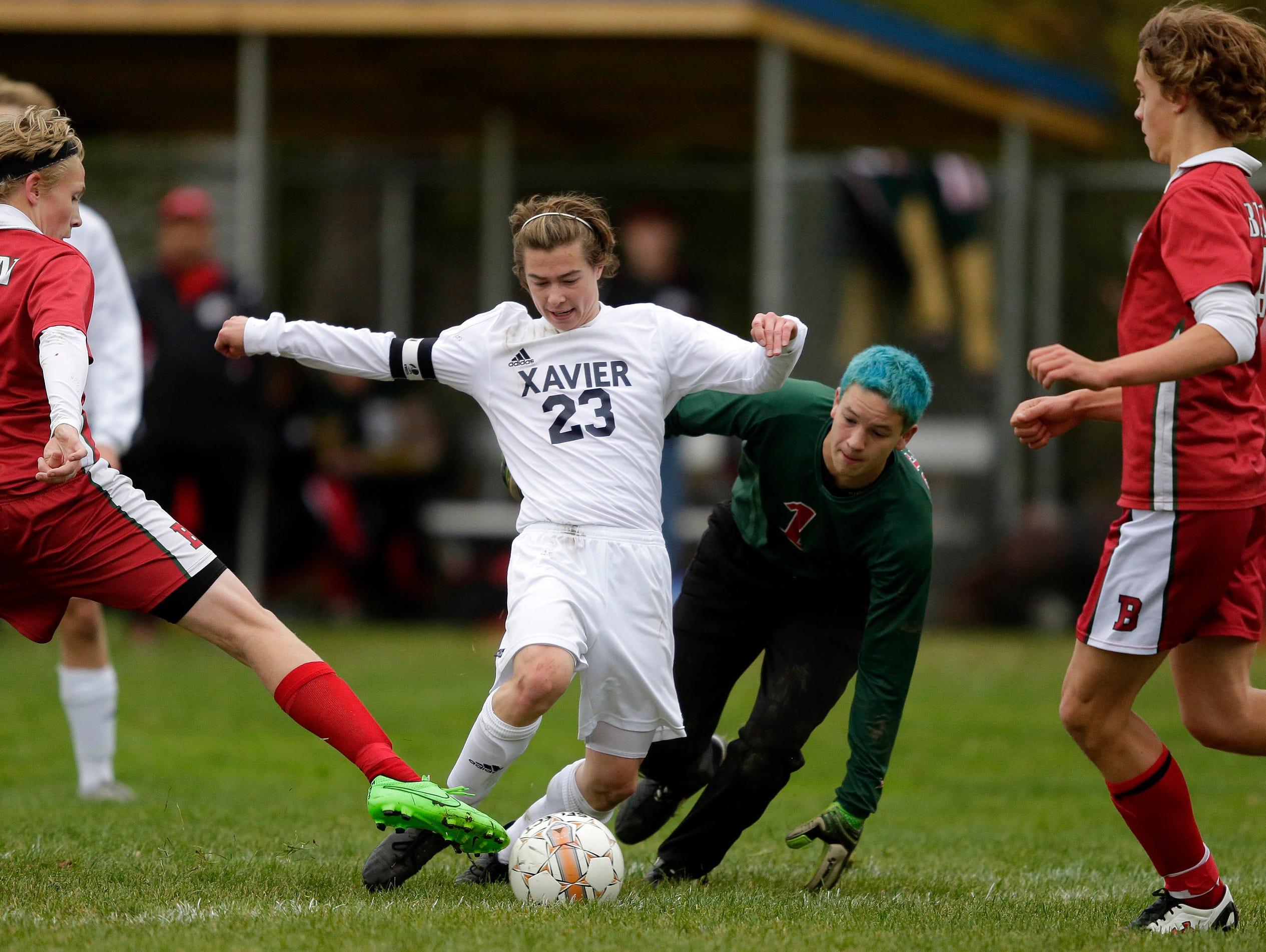 Seth Theilig of Xavier looks for an opening against Berlin in a Division 3 soccer regional championship game at Xavier High School in Appleton, Wis., Saturday, October 24, 2015. Ron Page/Post-Crescent Media