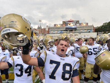 Georgia Tech offensive lineman Trey Braun celebrates with his team after a game. Braun was a two-way player for Leon High’s class of 2011.
