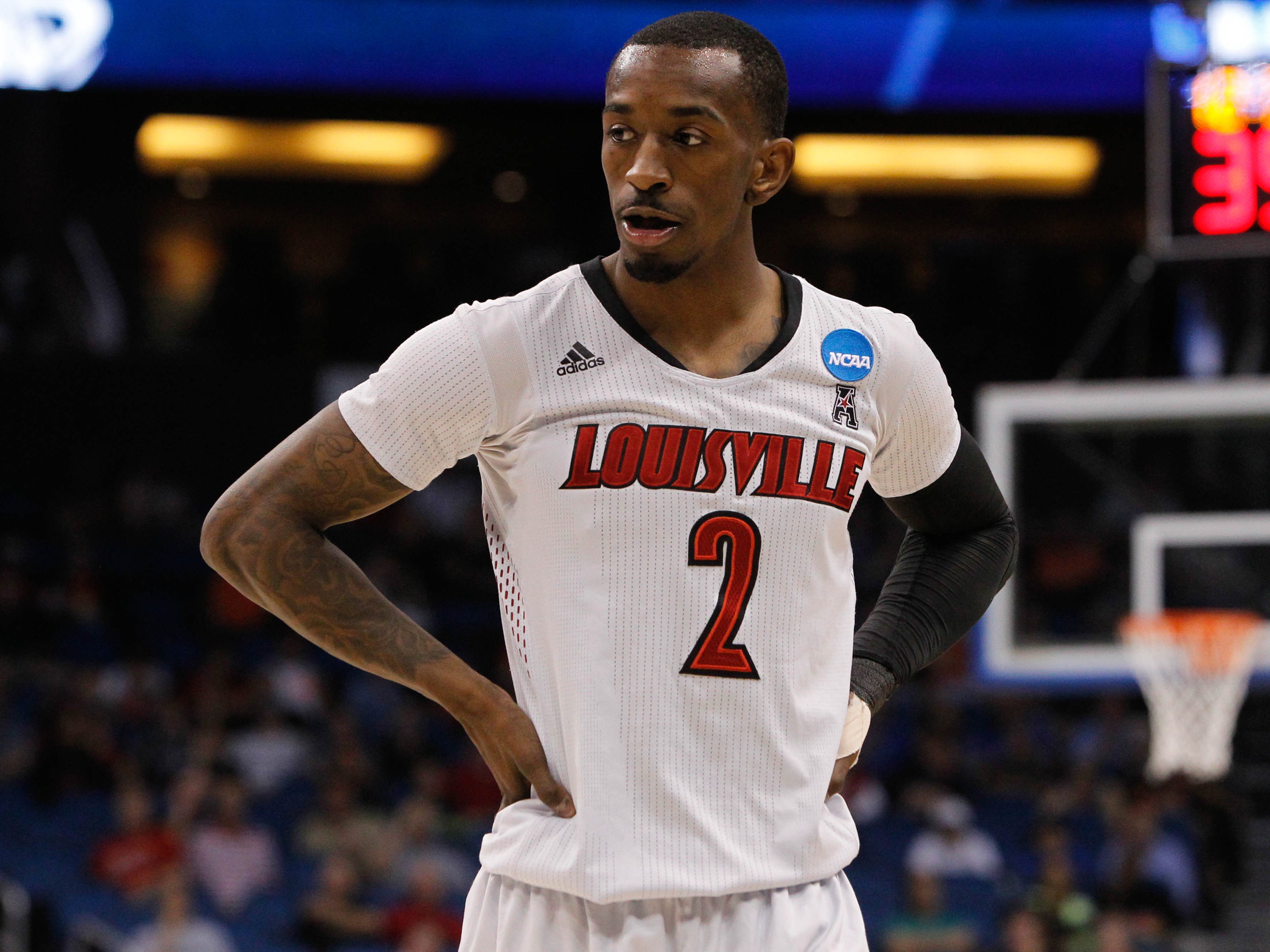Mar 20, 2014; Orlando, FL, USA; Louisville Cardinals guard Russ Smith (2) against the Manhattan Jaspers during the second half of a men's college basketball game during the second round of the 2014 NCAA Tournament at Amway Center. Mandatory Credit: Kim Klement-USA TODAY Sports