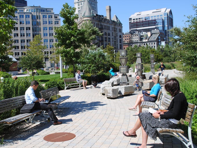 The Greenway is a mile and a half stretch of parks connecting the city. Here, locals sit in a Wharf District park.
