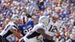 New England Patriots quarterback Tom Brady (12) passes to running back Shane Vereen (34) as Buffalo Bills defensive tackle Kyle Williams (95) rushes during the fourth quarter at Ralph Wilson Stadium. Patriots beat the Bills 23-21.