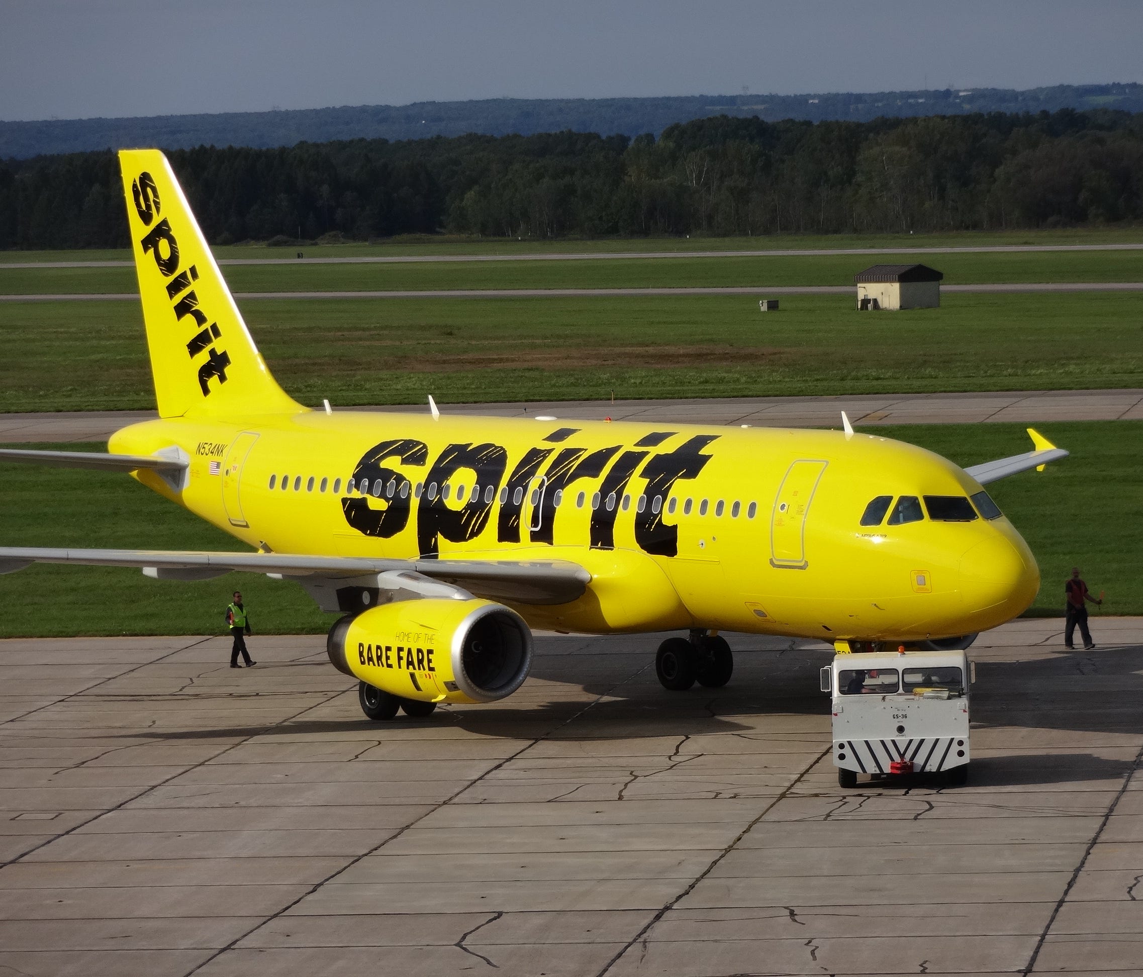 Spirit Airlines shows off its new paint scheme at an aircraft paint facility in Rome, N.Y., on Sept. 15, 2014.