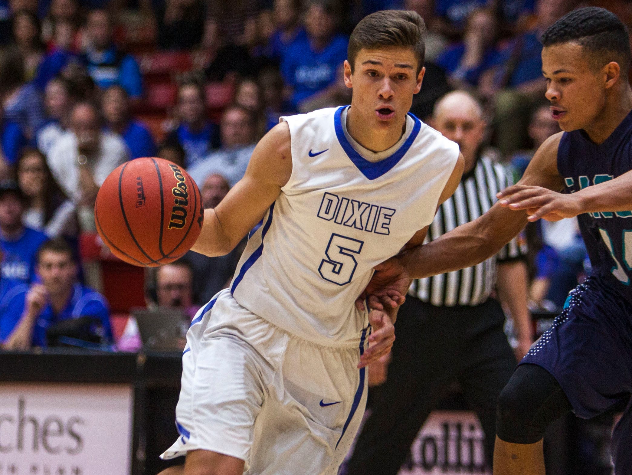 Dixie's Tyler Bennett drives the ball towards the basket during the game against Juan Diego in Saturday's 3A championship at the SUU Centrum, Feb. 27, 2016.