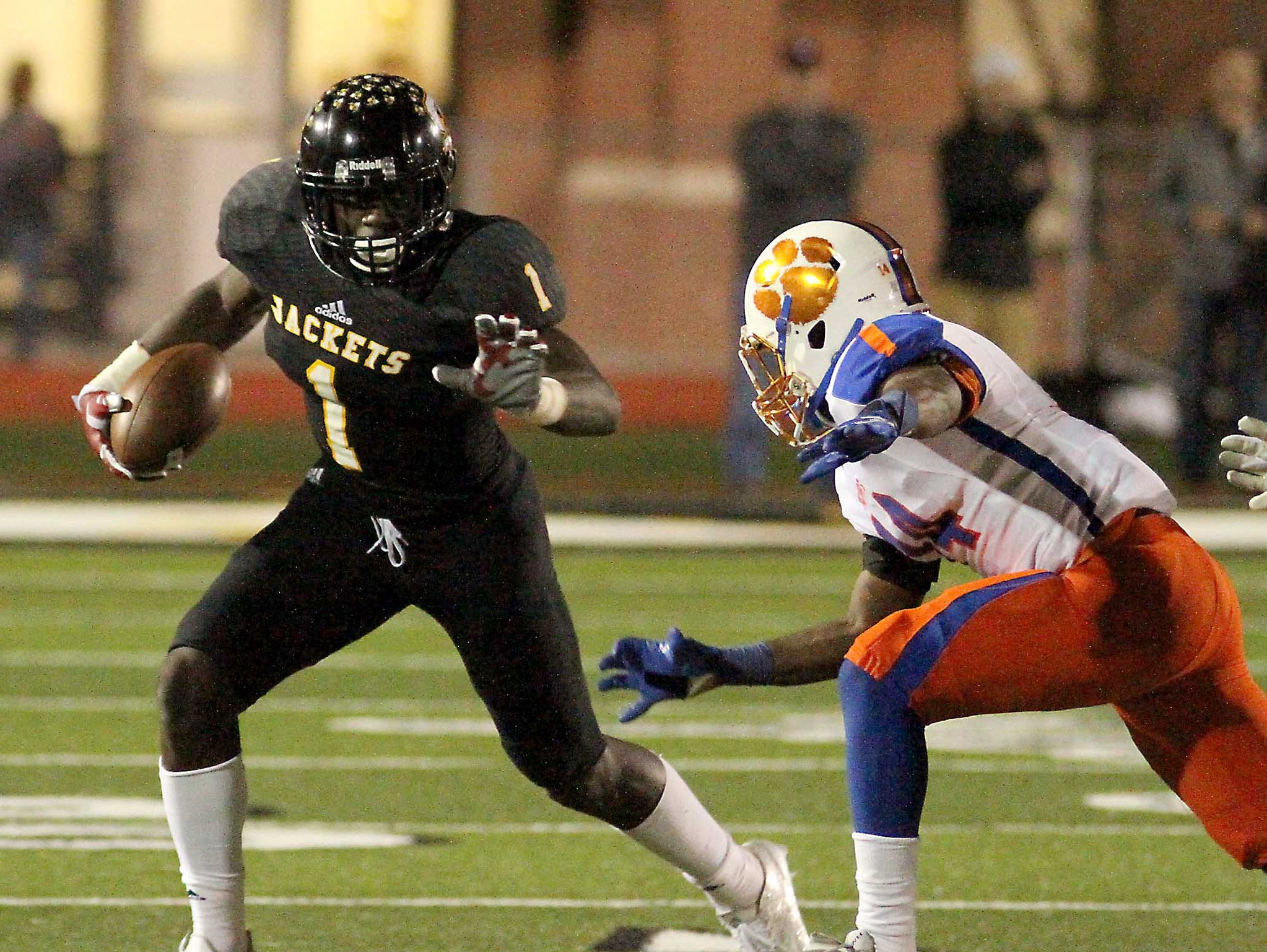 Starkville High's A. J. Brown (1) sprints away from Madison Central's AJ Brown (14) during the first half of the 6A North Half championship game in Starkville on Friday, Nov. 27, 2015. (Special to the Clarion Ledger/ Jim Lytle)