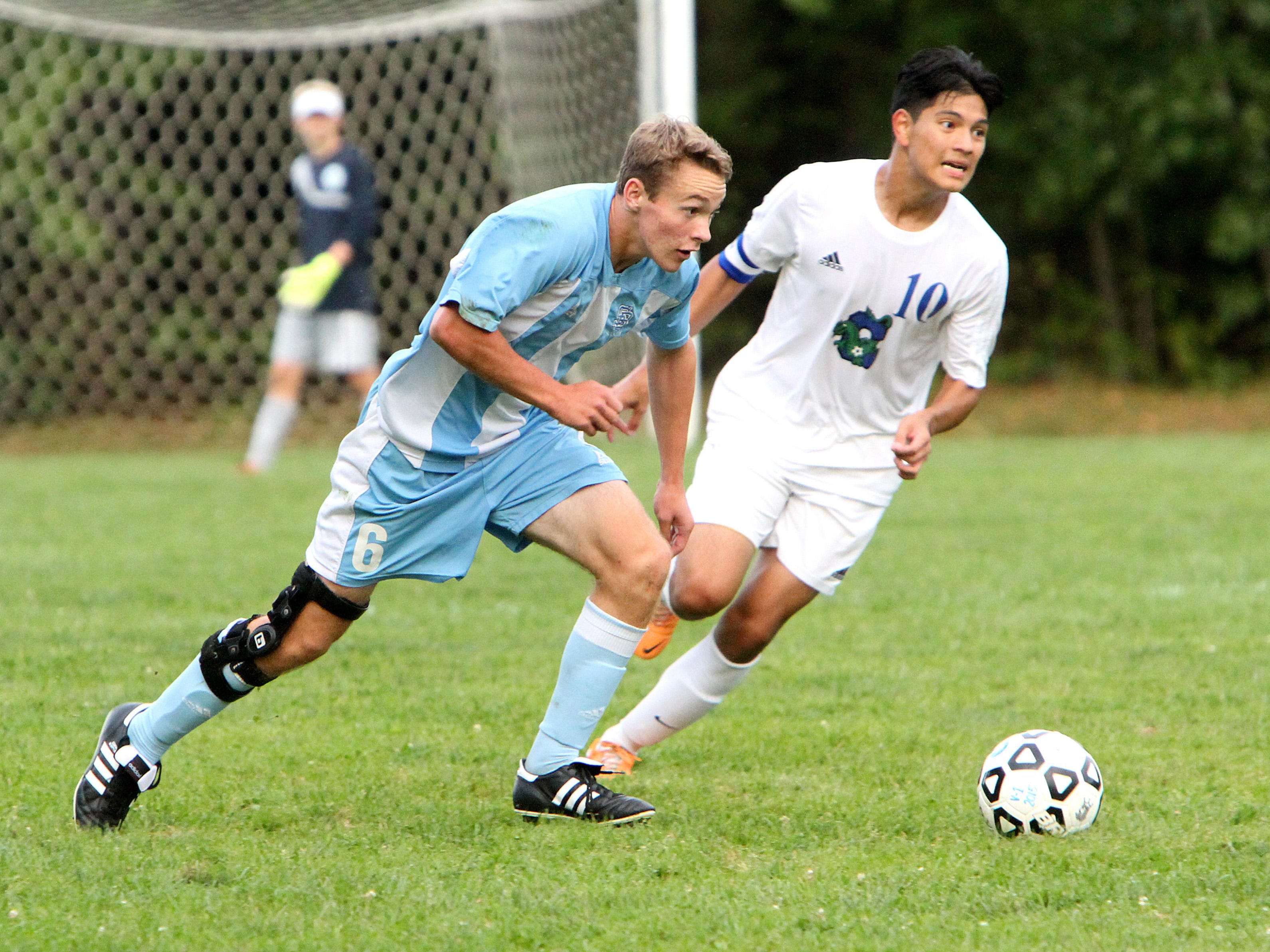 South Burlington’s Patrick O’Hara looks up field for a teammate during the Rebels’ 3-2 overtime win over Colchester. O’Hara scored the game winner with under five seconds left in overtime.