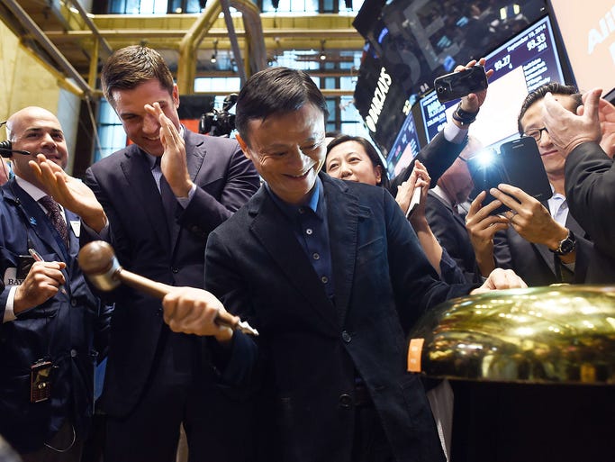 Jack Ma, founder of Chinese online retail giant Alibaba, rings a bell to open trading on the floor at the New York Stock Exchange on Sept. 19 in New York.