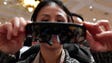 Claire Wen looks over ODG's new augmented reality glasses.
