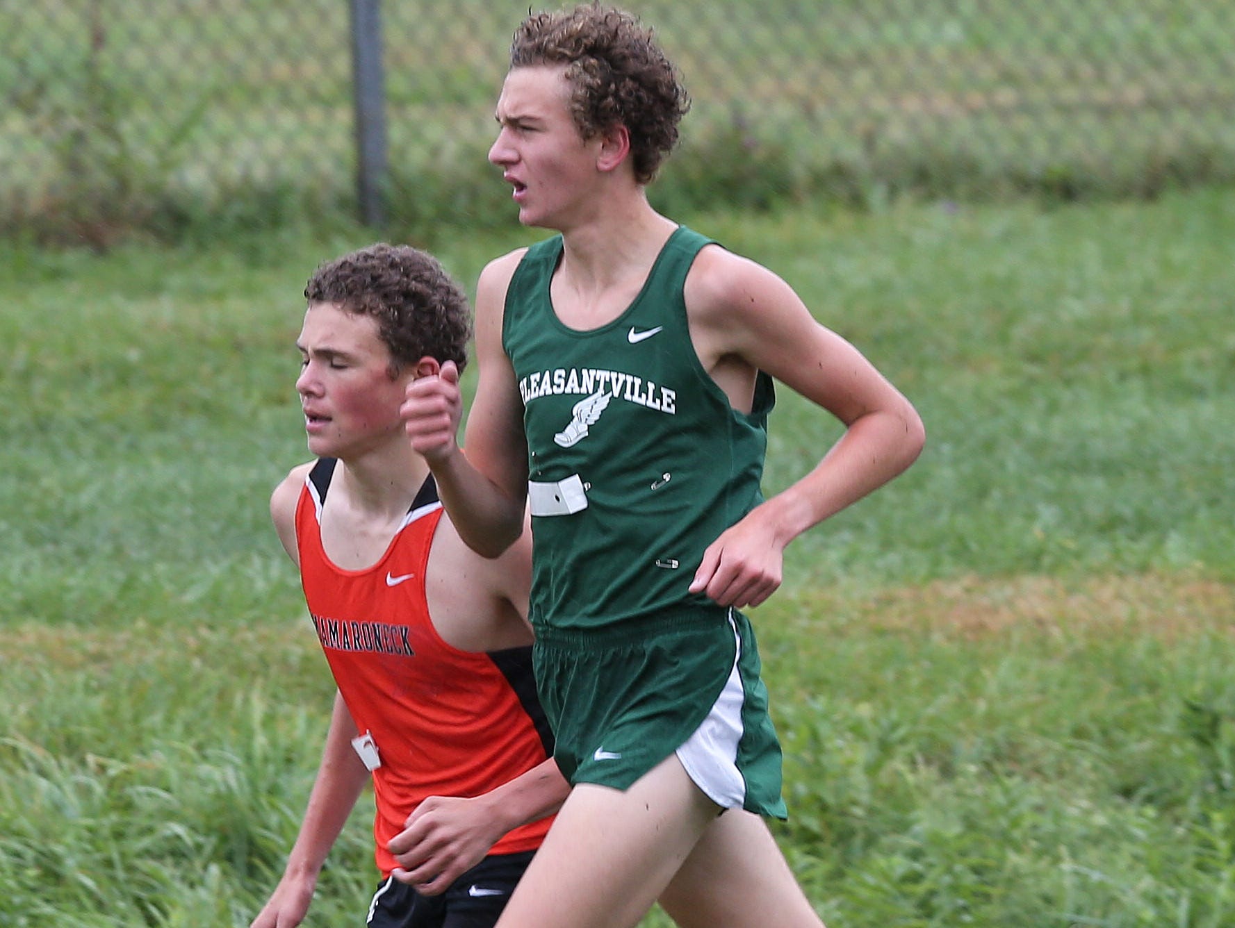 Pleasantville's Drew Dorflinger and Mamaroneck's Samuel Morton run side by side during the boys D 1 varsity race during the 38th annual Brewster Bear Classic Cross Country Invitational at Brewster High School Oct. 3, 2015. Dorflinger won the race with Morton finishing second.