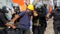 Egyptian riot police arrest a demonstrator.