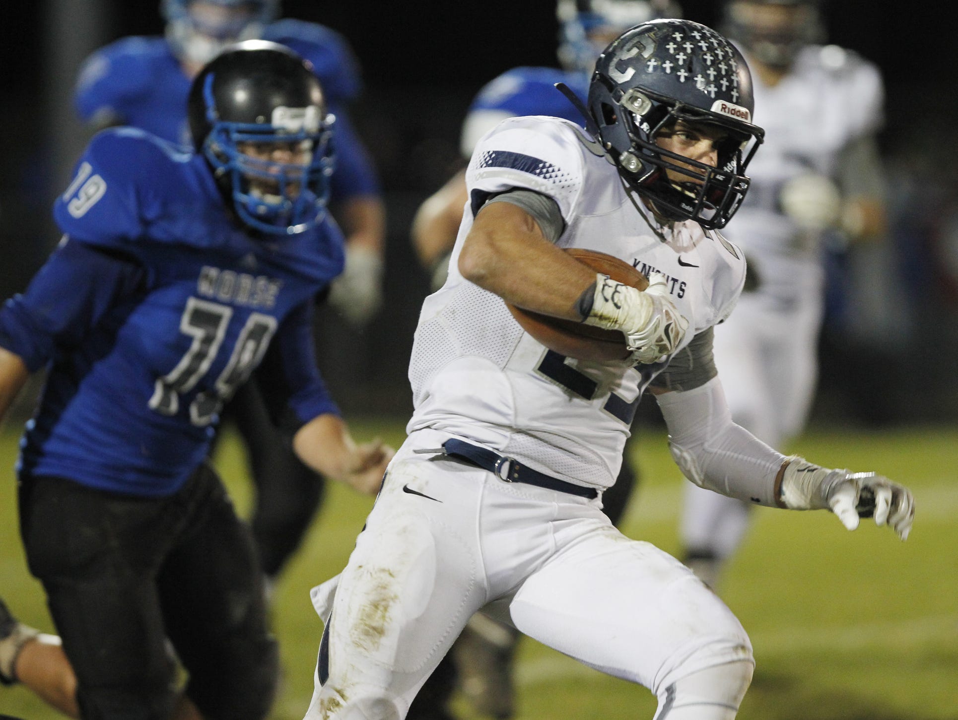 Jackson Anthrop with a carry for Central Catholic against Northfield, November 20, 2015, in Wabash.