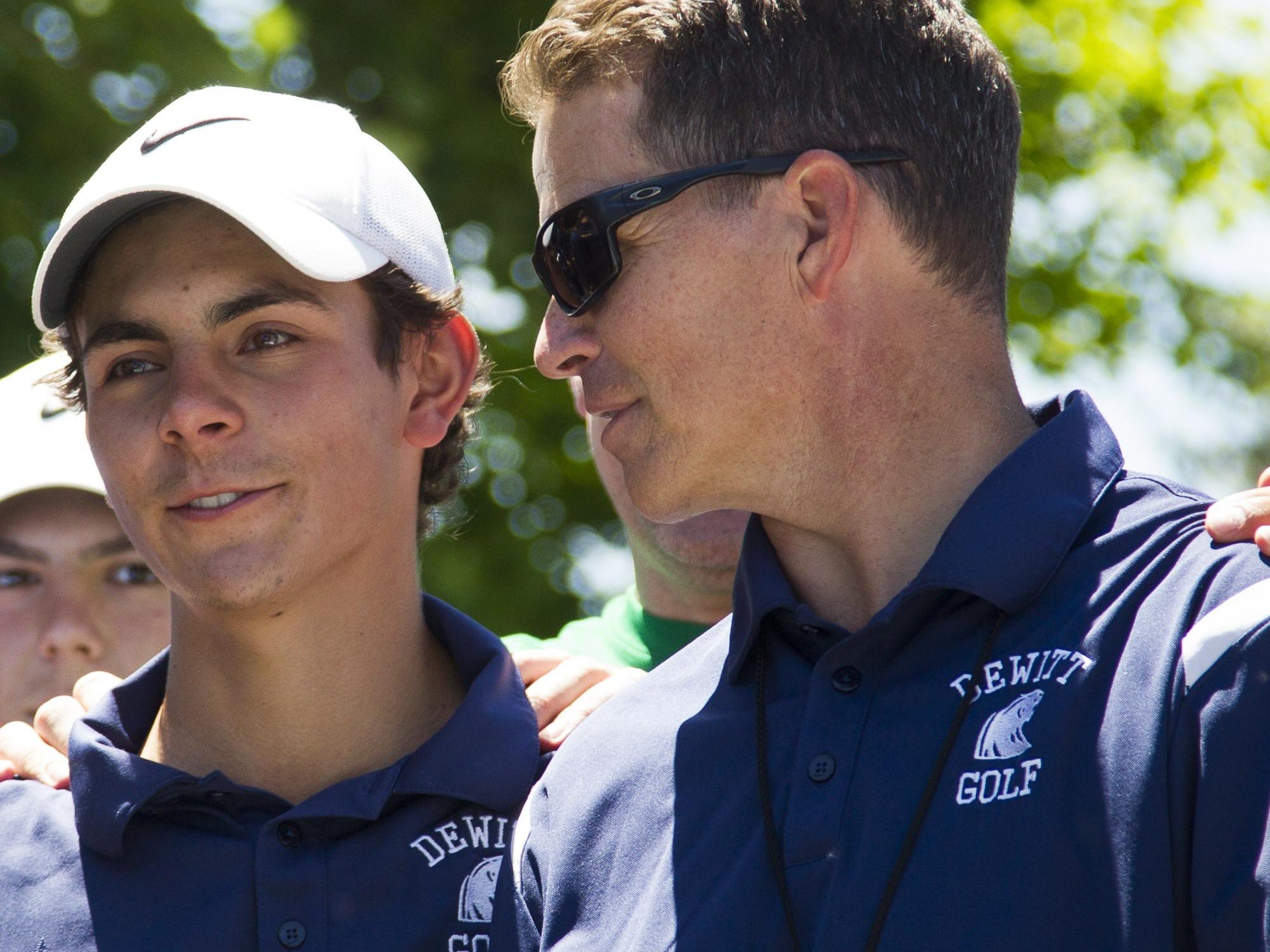 Dave Koenigsknecht, right, guided the DeWitt boys golf team to a Division 2 state title.