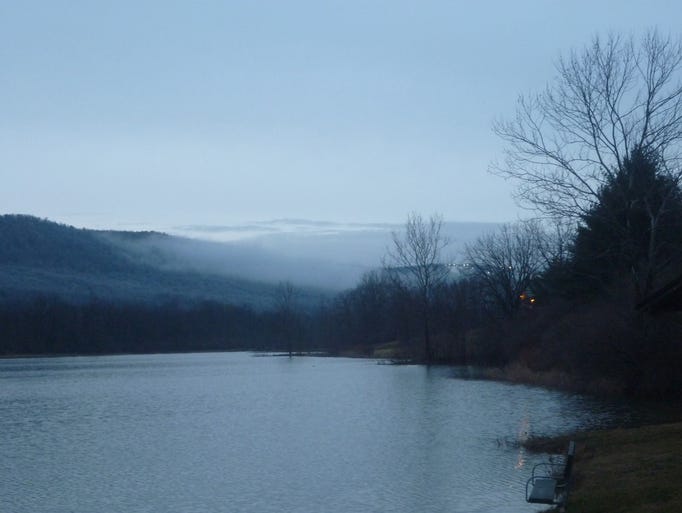 While visiting Blairs Valley, Maryland last evening I observed a distinct line separating the trees on the mountains with ice and those without ice. In the photo, you can see White Tail Resort to the right and Blairs Valley Lake tucked in against Sword Mountain. A lonely bench awaits warm weather when the fishermen will return.